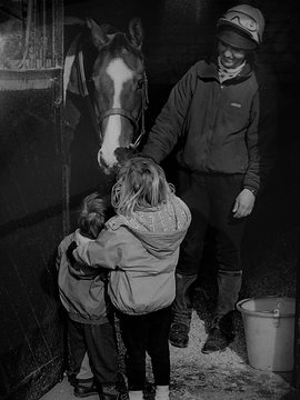 Iona Craig with a racehorse at champion trainer, Nicky Henderson's yard in Berkshire, England